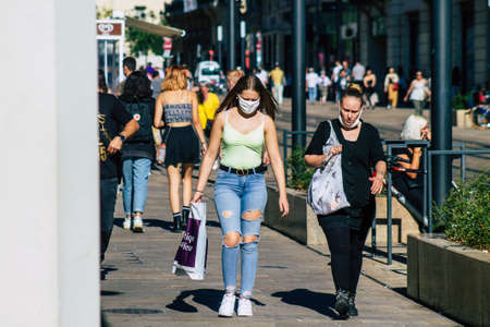 Reims France September 04, 2020 View of unidentified pedestrians with a face mask to protect themself from the coronavirus walking in the streets of Reims, a city in the Grand Est region of Franceのeditorial素材