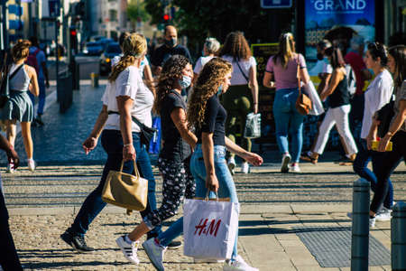 Reims France September 04, 2020 View of unidentified pedestrians with a face mask to protect themself from the coronavirus walking in the streets of Reims, a city in the Grand Est region of Franceのeditorial素材