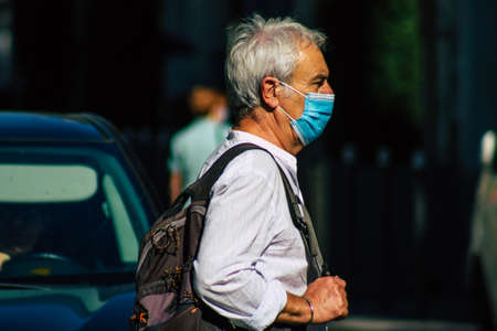Reims France September 04, 2020 View of unidentified pedestrians with a face mask to protect themself from the coronavirus walking in the streets of Reims, a city in the Grand Est region of Franceのeditorial素材