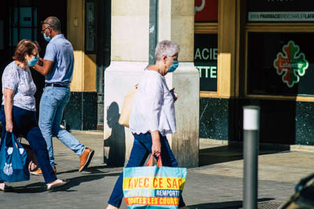 Reims France September 04, 2020 View of unidentified pedestrians with a face mask to protect themself from the coronavirus walking in the streets of Reims, a city in the Grand Est region of Franceのeditorial素材