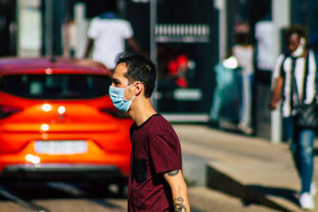Reims France September 04, 2020 View of unidentified pedestrians with a face mask to protect themself from the coronavirus walking in the streets of Reims, a city in the Grand Est region of Franceのeditorial素材