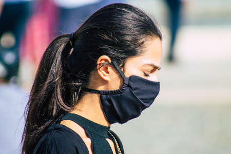 Reims France September 12, 2020 View of unidentified pedestrians with a face mask to protect themself from the coronavirus walking in the streets of Reims, a city in the Grand Est region of Franceのeditorial素材