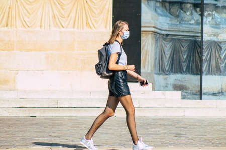 Reims France September 12, 2020 View of unidentified pedestrians with a face mask to protect themself from the coronavirus walking in the streets of Reims, a city in the Grand Est region of Franceのeditorial素材