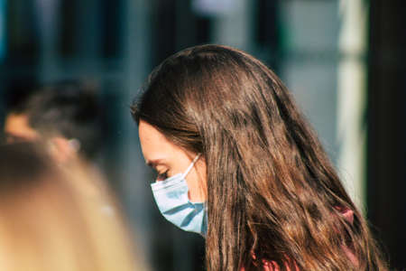 Reims France September 12, 2020 View of unidentified pedestrians with a face mask to protect themself from the coronavirus walking in the streets of Reims, a city in the Grand Est region of Franceのeditorial素材
