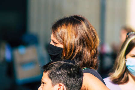 Reims France September 12, 2020 View of unidentified pedestrians with a face mask to protect themself from the coronavirus walking in the streets of Reims, a city in the Grand Est region of Franceのeditorial素材