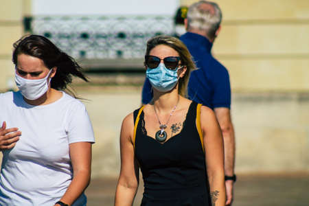 Reims France September 12, 2020 View of unidentified pedestrians with a face mask to protect...