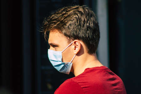 Reims France September 12, 2020 View of unidentified pedestrians with a face mask to protect themself from the coronavirus walking in the streets of Reims, a city in the Grand Est region of Franceのeditorial素材