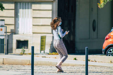Reims France September 12, 2020 View of unidentified pedestrians with a face mask to protect themself from the coronavirus walking in the streets of Reims, a city in the Grand Est region of Franceのeditorial素材