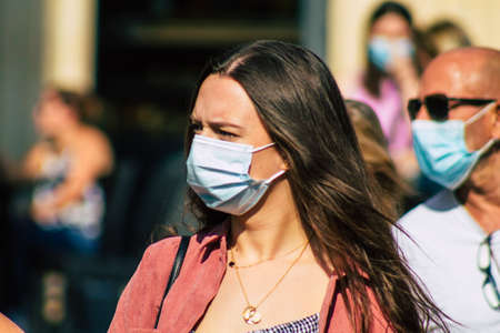 Reims France September 12, 2020 View of unidentified pedestrians with a face mask to protect themself from the coronavirus walking in the streets of Reims, a city in the Grand Est region of Franceのeditorial素材