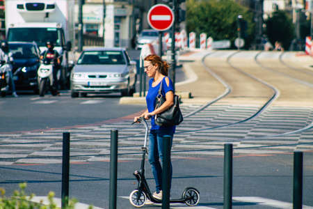 Reims France September 12, 2020 View of unidentified people rolling with an electric scooter in the...