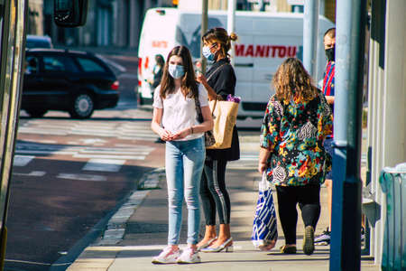 Reims France September 15, 2020 View of unidentified pedestrians with a face mask to protect themself from the coronavirus walking in the streets of Reims, a city in the Grand Est region of Franceのeditorial素材