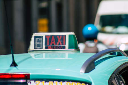 Lisbon Portugal july 28, 2020 View of a taxi for passengers driving through the streets of Lisbon, the hilly coastal capital city of Portugal and one of the stunning oldest cities in Europeのeditorial素材