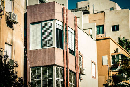View of the facade of a modern building in the streets of Tel Aviv in Israelの写真素材