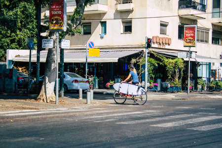 Tel Aviv Israel September 29, 2020 View of an unidentified people with a face mask to protect from the Coronavirus rolling in the empty streets of Tel Aviv during lockdown and Coronavirus outbreakのeditorial素材