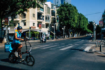 Tel Aviv Israel September 29, 2020 View of an unidentified people with a face mask to protect from the Coronavirus rolling in the empty streets of Tel Aviv during lockdown and Coronavirus outbreakのeditorial素材