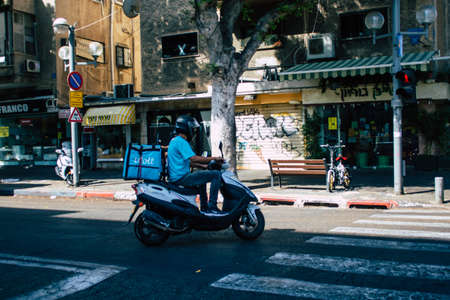 Tel Aviv Israel September 29, 2020 View of an unidentified people with a face mask to protect from the Coronavirus rolling in the empty streets of Tel Aviv during lockdown and Coronavirus outbreakのeditorial素材
