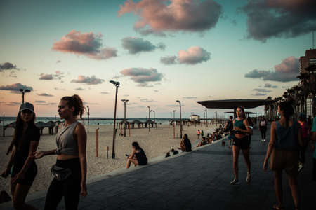 Tel Aviv Israel October 04, 2020 View of unidentified people without a face mask to protect themself walking on Herbert Samuel Promenade in Tel Aviv during lockdown and Coronavirus outbreakのeditorial素材