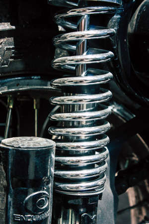 Closeup of a motorcycle rolling in the streets of the city center of the metropolitan areaの写真素材