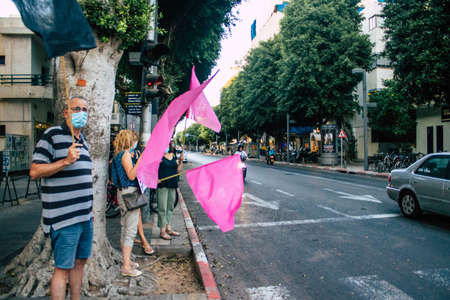 Tel Aviv Israel October 10, 2020 View of unidentified Israeli people demonstrating in the streets of Tel Aviv against the government s policies regarding the handling of the coronavirus epidemicのeditorial素材