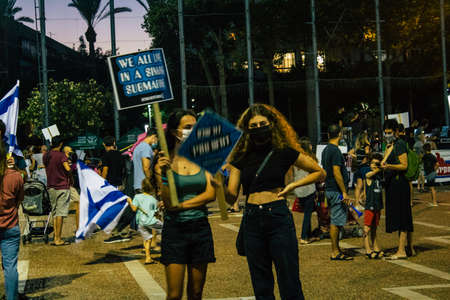 Tel Aviv Israel October 17, 2020 Unidentified people participating in a protest against government policy in Rabin Square opposite Tel Aviv City Hall despite the coronavirus outbreak and lockdownのeditorial素材