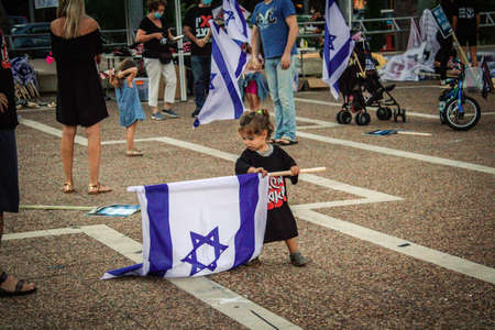 Tel Aviv Israel October 17, 2020 Unidentified people participating in a protest against government policy in Rabin Square opposite Tel Aviv City Hall despite the coronavirus outbreak and lockdownのeditorial素材