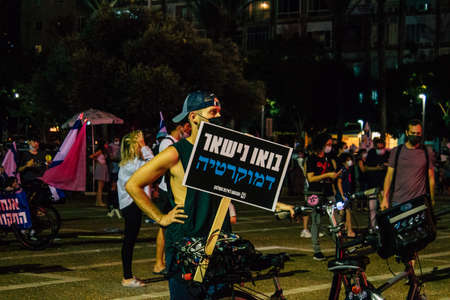 Tel Aviv Israel October 17, 2020 Unidentified people participating in a protest against government policy in Rabin Square opposite Tel Aviv City Hall despite the coronavirus outbreak and lockdownのeditorial素材