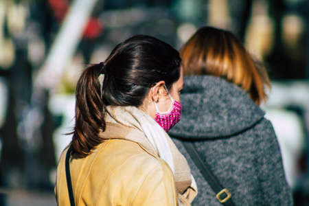 Reims France November 04, 2020 View of unidentified pedestrians with a face mask to protect themself from the coronavirus walking in the streets of Reims during the pandemic affecting Franceのeditorial素材