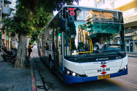 Tel Aviv Israel December 20, 2020 View of an Israeli public bus driving through the streets of Tel Aviv during the lockdown and Coronavirus outbreak in Israelのeditorial素材