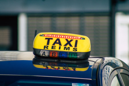 View of a traditional taxi for passengers rolling in the historical streets of Reims, a city in the Grand Est region of France and one of the oldest in Europeの写真素材