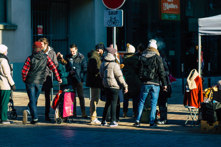Reims France January 09, 2021 View of unidentified people with a face mask shopping at the market in downtown during Coronavirus outbreak and lockdown to enforce containment of the populationのeditorial素材