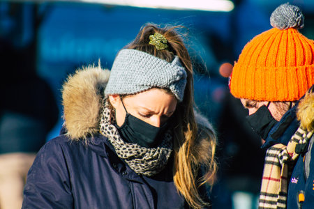 Reims France January 09, 2021 View of unidentified people with a face mask shopping at the market in downtown during Coronavirus outbreak and lockdown to enforce containment of the populationのeditorial素材