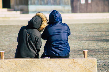 Reims France January 09, 2021 View of unidentified french people sitting in the streets of Reims to take a lunch because all the restaurants closed during the pandemic affecting Franceの写真素材
