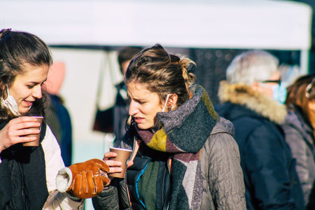 Reims France January 09, 2021 View of unidentified people with a face mask shopping at the market in downtown during Coronavirus outbreak and lockdown to enforce containment of the populationのeditorial素材