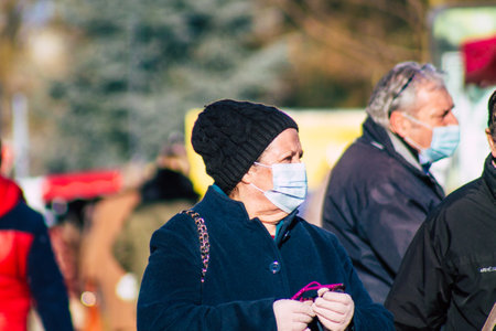 Reims France January 09, 2021 View of unidentified people with a face mask shopping at the market in downtown during Coronavirus outbreak and lockdown to enforce containment of the populationのeditorial素材