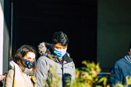 Reims France January 09, 2021 View of unidentified people with a face mask shopping at the market in downtown during Coronavirus outbreak and lockdown to enforce containment of the populationのeditorial素材