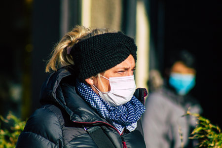 Reims France January 09, 2021 View of unidentified people with a face mask shopping at the market in downtown during Coronavirus outbreak and lockdown to enforce containment of the populationのeditorial素材