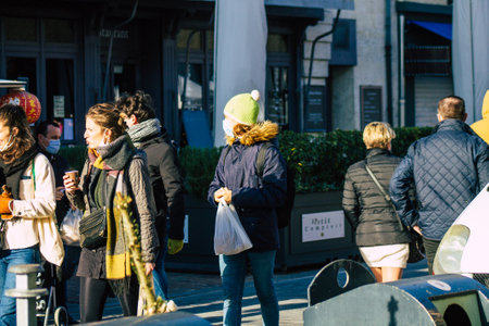 Reims France January 09, 2021 View of unidentified people with a face mask shopping at the market in downtown during Coronavirus outbreak and lockdown to enforce containment of the populationのeditorial素材