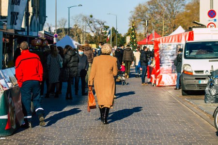 Reims France January 09, 2021 View of unidentified people with a face mask shopping at the market in downtown during Coronavirus outbreak and lockdown to enforce containment of the populationのeditorial素材