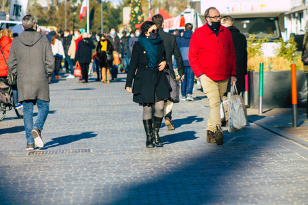Reims France January 09, 2021 View of unidentified people with a face mask shopping at the market in downtown during Coronavirus outbreak and lockdown to enforce containment of the populationのeditorial素材