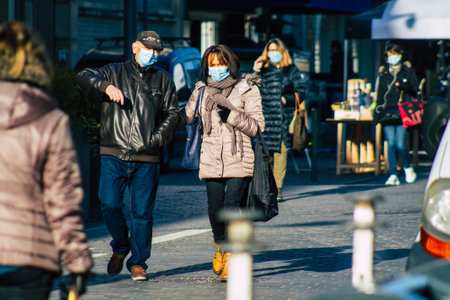 Reims France January 09, 2021 View of unidentified people with a face mask shopping at the market in downtown during Coronavirus outbreak and lockdown to enforce containment of the populationのeditorial素材