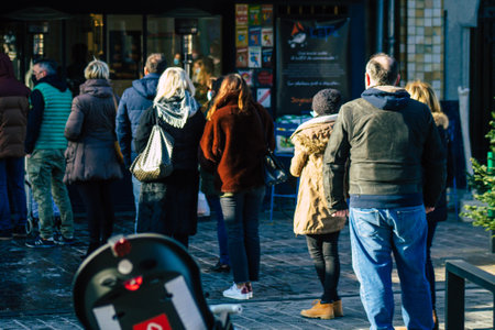 Reims France January 09, 2021 View of unidentified people with a face mask shopping at the market in downtown during Coronavirus outbreak and lockdown to enforce containment of the populationのeditorial素材