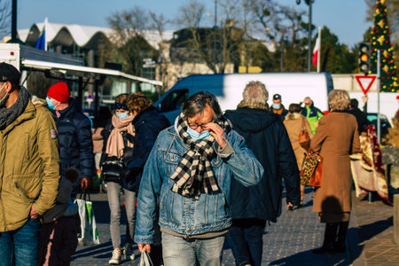 Reims France January 09, 2021 View of unidentified people with a face mask shopping at the market in downtown during Coronavirus outbreak and lockdown to enforce containment of the populationのeditorial素材