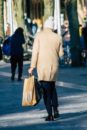 Reims France January 09, 2021 View of unidentified pedestrian with a face mask to protect themself from the coronavirus walking in the streets of Reims during the pandemic affecting Franceのeditorial素材
