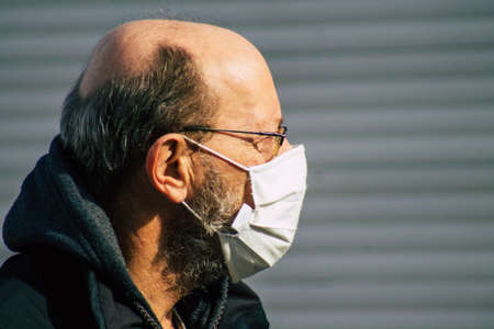 Reims France February 20, 2021 Unidentified pedestrian with a face mask to protect  from the...