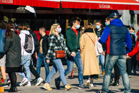 Reims France February 27, 2021 Unidentified pedestrians with a face mask to protect themself from...