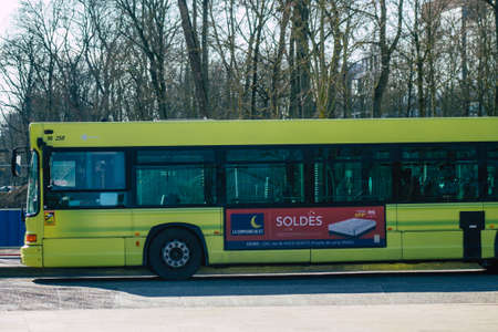 Reims France February 27, 2021 City bus for passengers driving through the streets during coronavirus outbreak hitting France and part of the public transport system of Reimsのeditorial素材