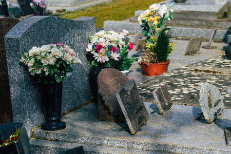 Reims France March 03, 2021 Religious objects of memories placed on the graves in the cemetery of the city of Reims during the coronavirus pandemic hitting Franceのeditorial素材