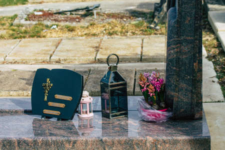 Reims France March 03, 2021 Religious objects of memories placed on the graves in the cemetery of the city of Reims during the coronavirus pandemic hitting Franceのeditorial素材