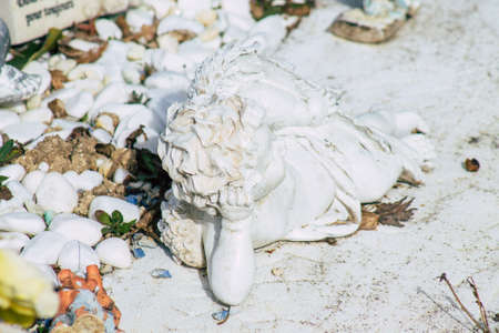 Reims France March 03, 2021 Religious objects of memories placed on the graves in the cemetery of the city of Reims during the coronavirus pandemic hitting Franceのeditorial素材