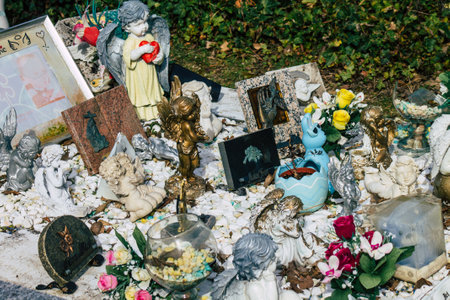 Reims France March 03, 2021 Religious objects of memories placed on the graves in the cemetery of the city of Reims during the coronavirus pandemic hitting Franceのeditorial素材